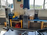 a workbench with tools on it in a room