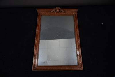 a mirror hanging on the wall in a room