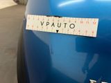 a sticker that says vauto on the back of a blue motorcycle