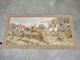 an image of a rug with a picture of a hunting scene on it