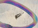 a picture of a rainbow colored bracelet with a name on it