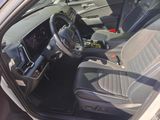 the interior of a car with the door open and the steering wheel down