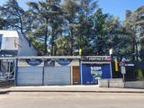 a building that has a store on the side of the street