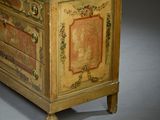 a small cabinet with a marble top on a gray surface