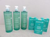 a group of three bottles of skin care products sitting next to each other
