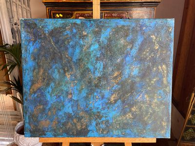 a painting that is on a easel in a room