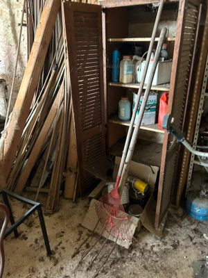 a pile of junk in the corner of a room