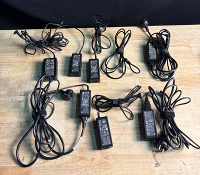 a lot of power cords that are on the table
