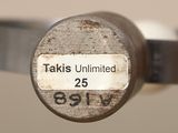 a close up of a metal object with a tag on it