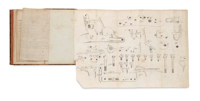 an open book with drawings on it sitting on top of a table