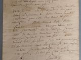 un gros plan d'un morceau de papier sur lequel on a écrit
