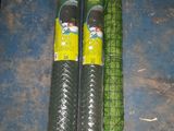 two rolls of gabio nets on the floor