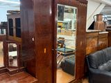 an image of a living room with a couch and a mirror