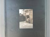 a black book with a picture of a man and a dog on the cover