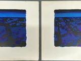 two pictures of blue and black paintings on a white wall