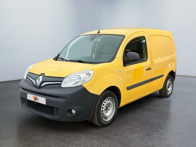 the yellow van is parked in a large room with a black floor
