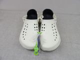 a pair of white shoes with holes on them