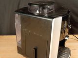 a coffee machine that is sitting on a wooden table