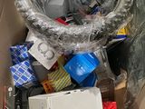 a cardboard box filled with electronics and other items