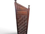an image of a tall wooden cabinet with a geometric design
