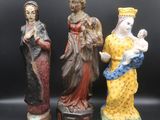 three figurines of the three wise men and the wise woman
