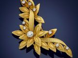 a gold and diamond broochle, by van cleef