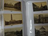 an open book with pictures of buildings and a clock tower in the background