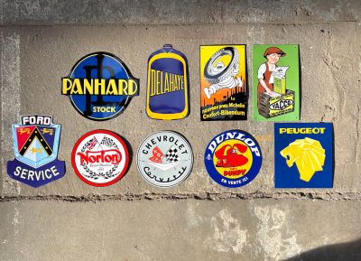 many different stickers on the wall of a building