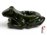 a green frog shaped ashtray sitting on a white surface