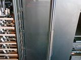 an image of a wine cooler with many bottles in it