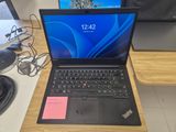 a laptop that is sitting on a desk next to a monitor