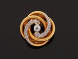 an 18k yellow gold and diamond broochle
