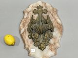 a picture of a wall plaque with a lemon next to it