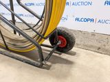 a cart with a hose attached to the side of it