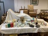 a table with many items on it in a room
