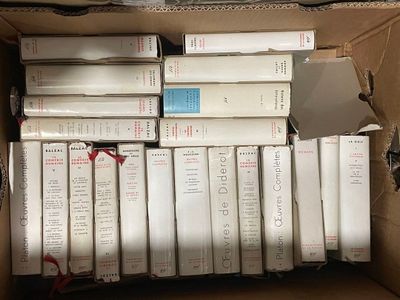 a box full of books sitting on top of a table