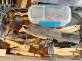 many different types of kitchen utensils in a metal container