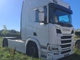 a white truck that is parked in the grass