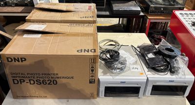 many boxes of electronics on a table in a room