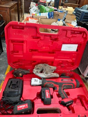 a red tool box with tools in it on the floor
