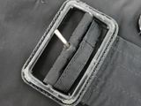 a belt that has a metal buckle on it