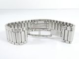 a close up of a watch on a white surface with a white background