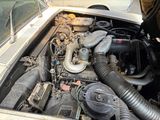 a car engine with a lot of hoses in it