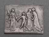 une image représentant une plaque sur laquelle figure une femme tenant la main d'un homme et un homme tenant la main d'une femme