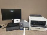 two computers and a printer sitting on a desk