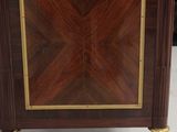 an antique wooden cabinet with a marble top and gold trimming