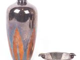 a vase and a bowl sitting next to each other on a white surface