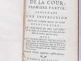 an open book on a white surface with a black and white title