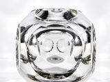 a clear glass vase with a smiley face on it