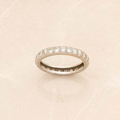an image of a diamond wedding ring on a table